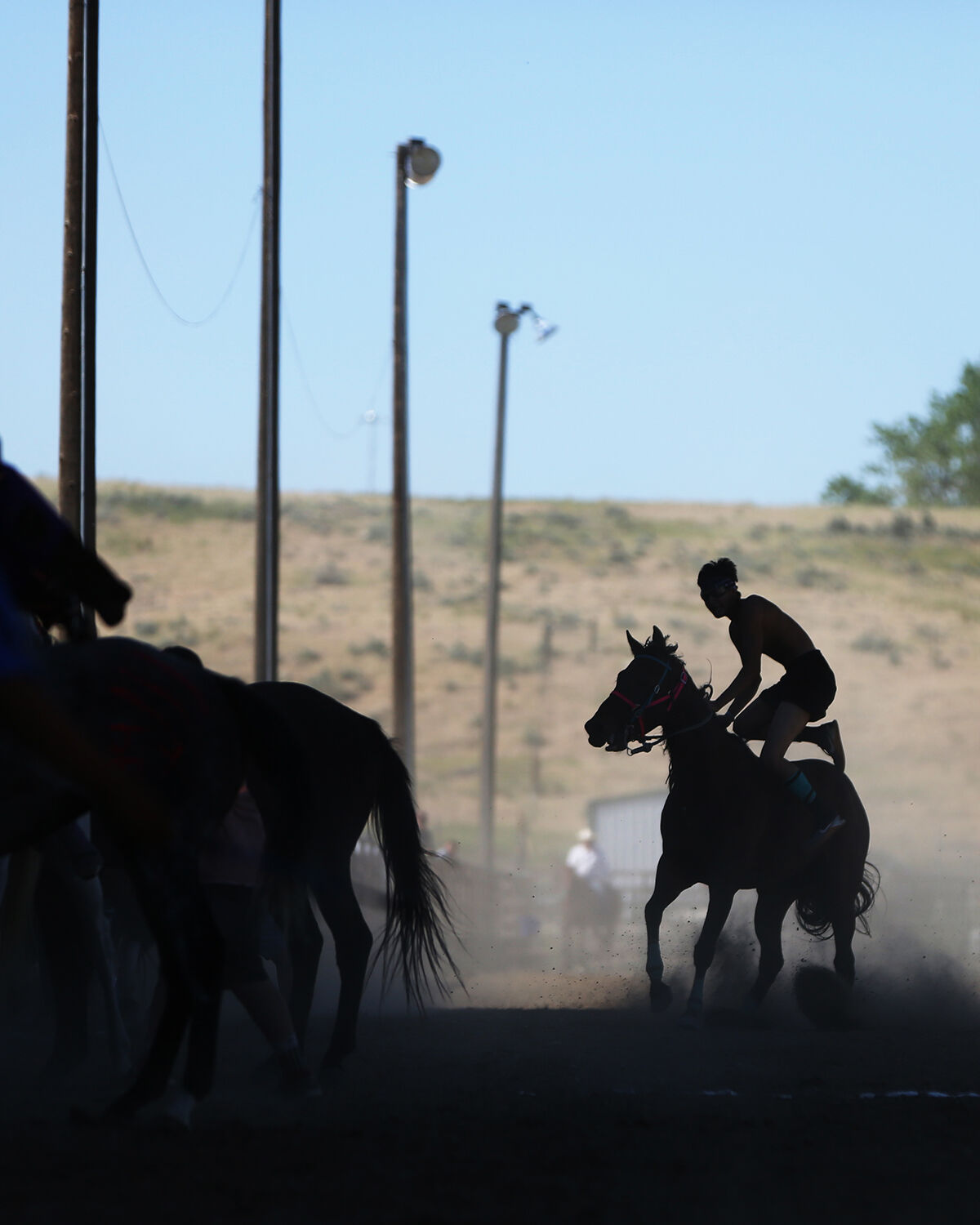 The riders complete a half mile lap with each of their horses